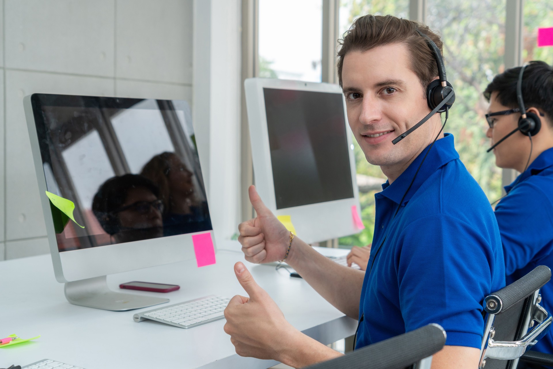 Business people wearing headset working in office